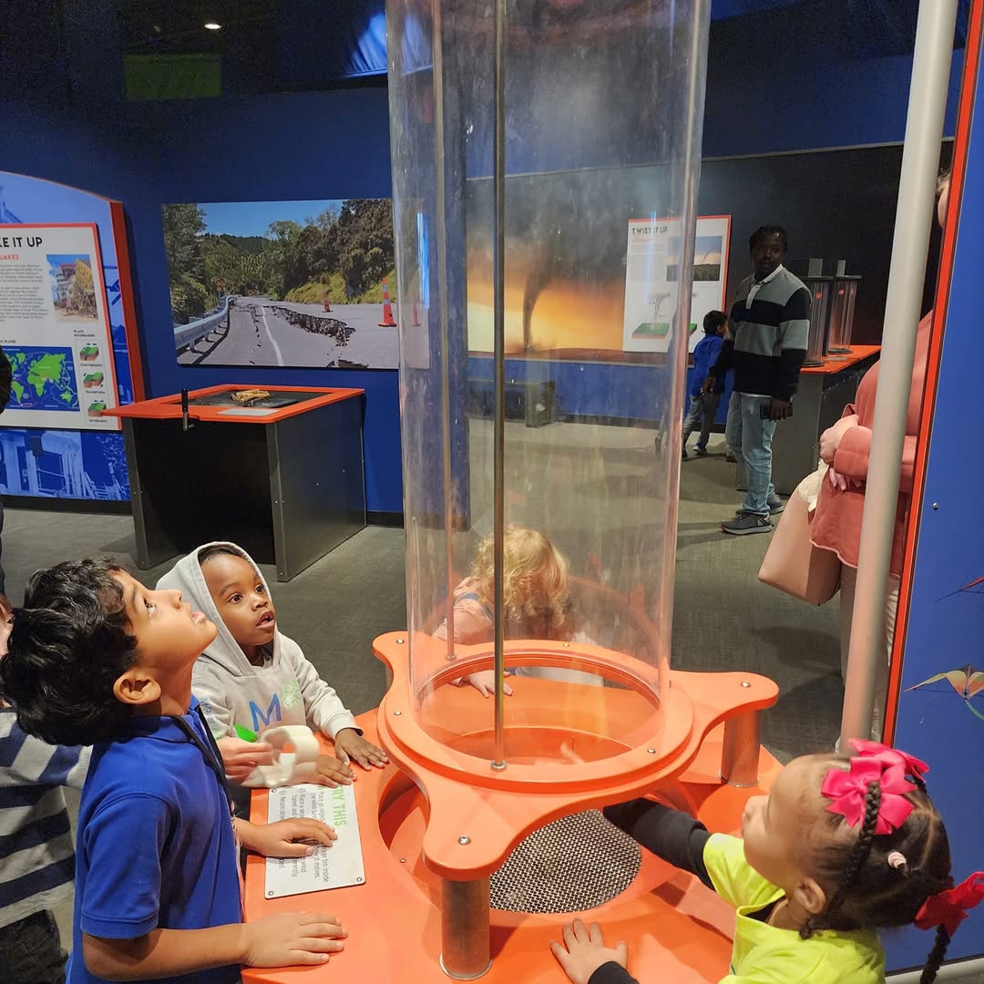 Children at a science museum exhibit