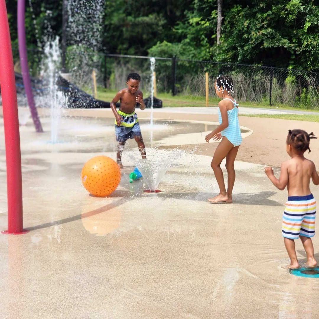 Children playing at a splash pad